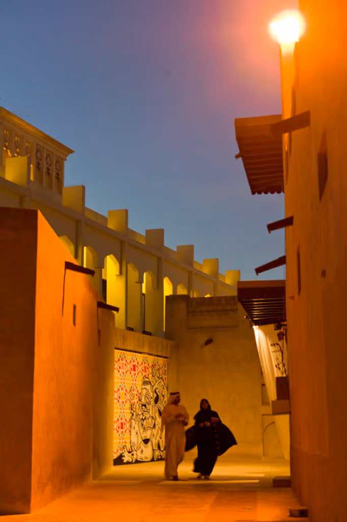 Bastakya and an Emirati couple at night, Duba