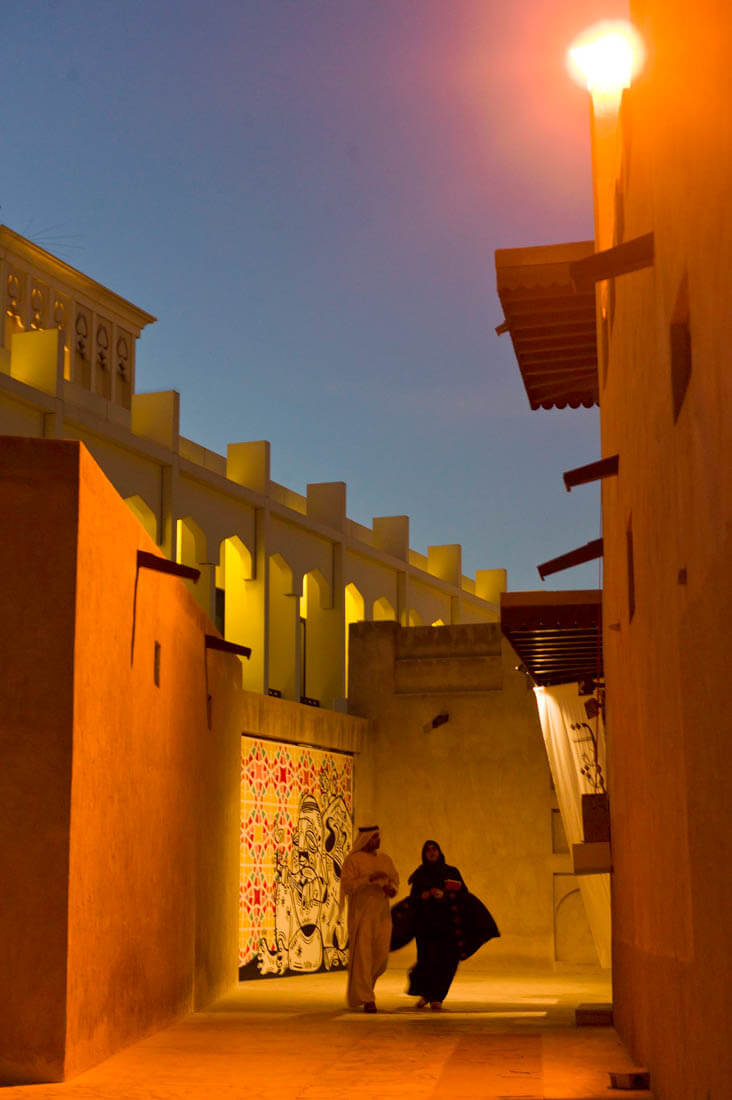 Bastakya and an Emirati couple at night, Dubai