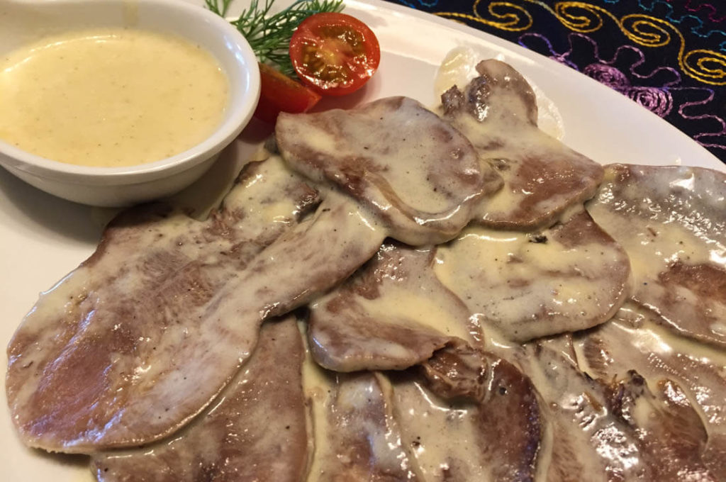 Uzbek Beef tongue, fried in a mild garlic cream sauce