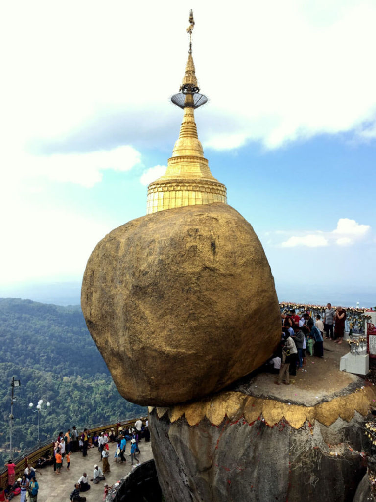 Local Myanmar people praying to the Golden Rock