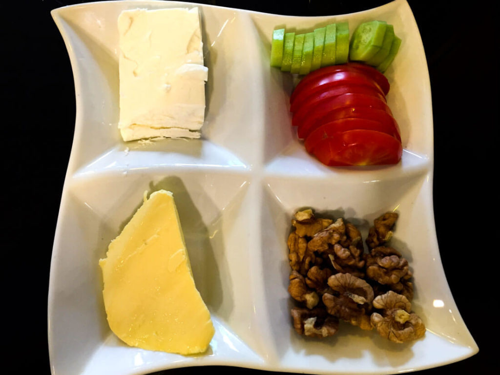 Traditional Iranian breakfast consist of feta cheese and walnuts